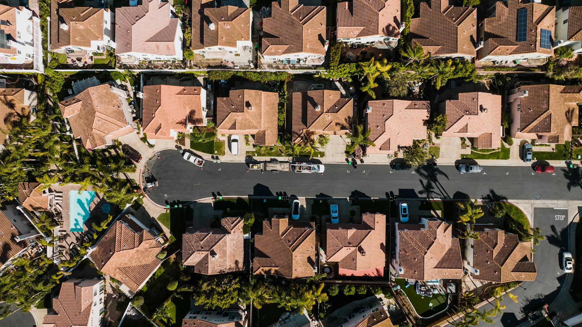 Aerial photograph showcasing a suburban neighborhood in Costa Mesa, CA, with neatly arranged houses and streets.