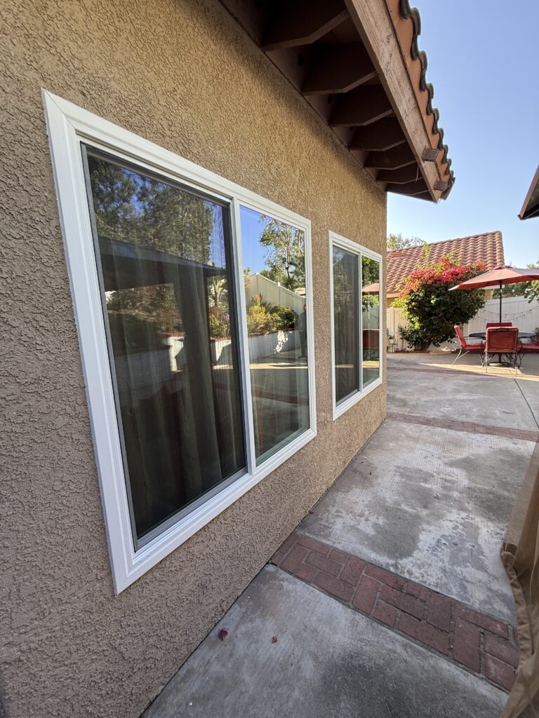 Retrofit window and door installation service showing a professional Z-bar frame finish.